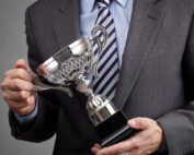 image of man holding award